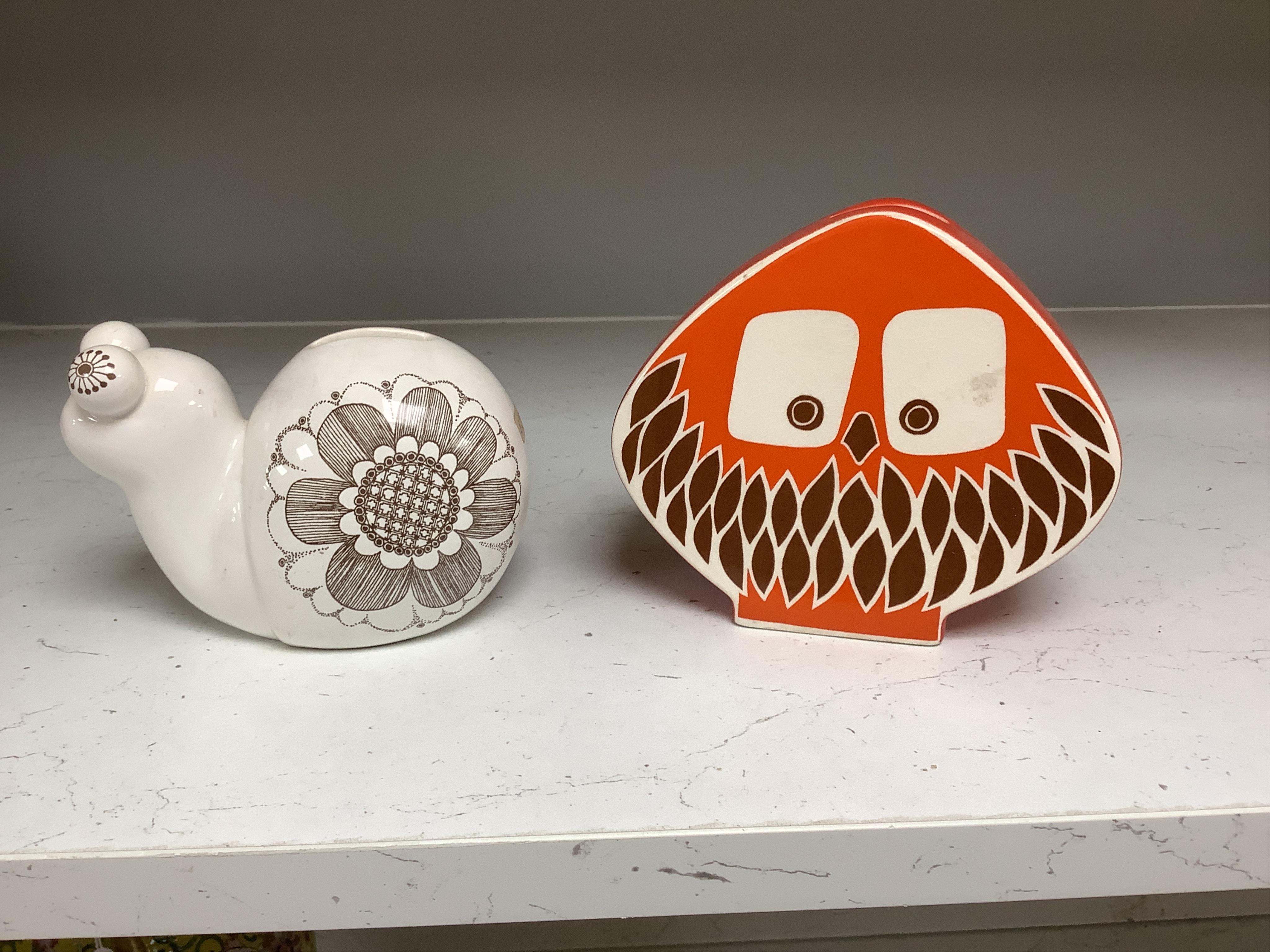 Seven mostly Carlton Ware 1960’s-1970’s money boxes to include examples in the form of a snail, train and two cats, largest 20cm wide. Condition - mostly fair to good